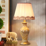 Beige Urn Night Light Rustic Ceramic 1 Head Living Room Table Lighting with Pleated Fabric Shade Clearhalo 'Lamps' 'Table Lamps' Lighting' 1034377