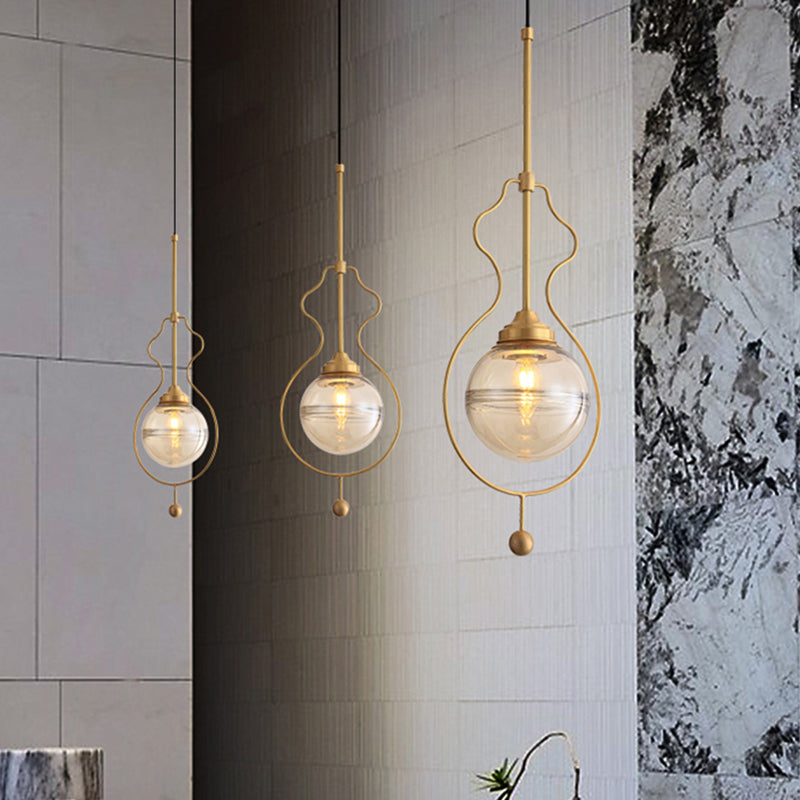 Clear Glass Ball Shade Ceiling Lamp Postmodern 1-Light Hanging Pendant Light with Ground Frame in Gold Clearhalo 'Ceiling Lights' 'Modern Pendants' 'Modern' 'Pendant Lights' 'Pendants' Lighting' 1125179