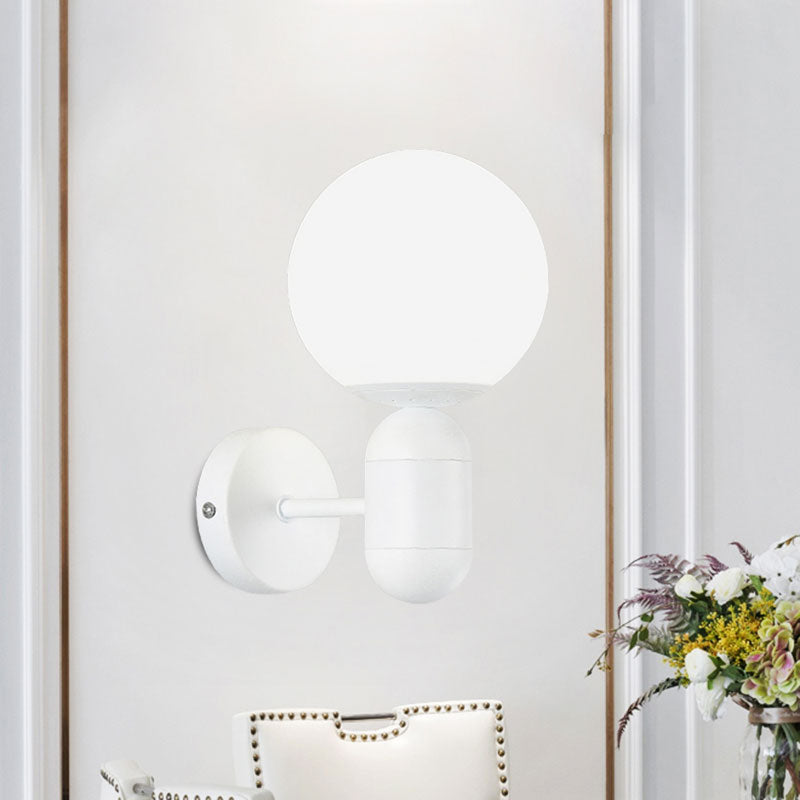 White Globe Shade Wall Lamp with Capsule Body Modern Metal & Glass Wall Light for Meeting Room Clearhalo 'Cast Iron' 'Glass' 'Industrial' 'Modern wall lights' 'Modern' 'Tiffany' 'Traditional wall lights' 'Wall Lamps & Sconces' 'Wall Lights' Lighting' 1127893