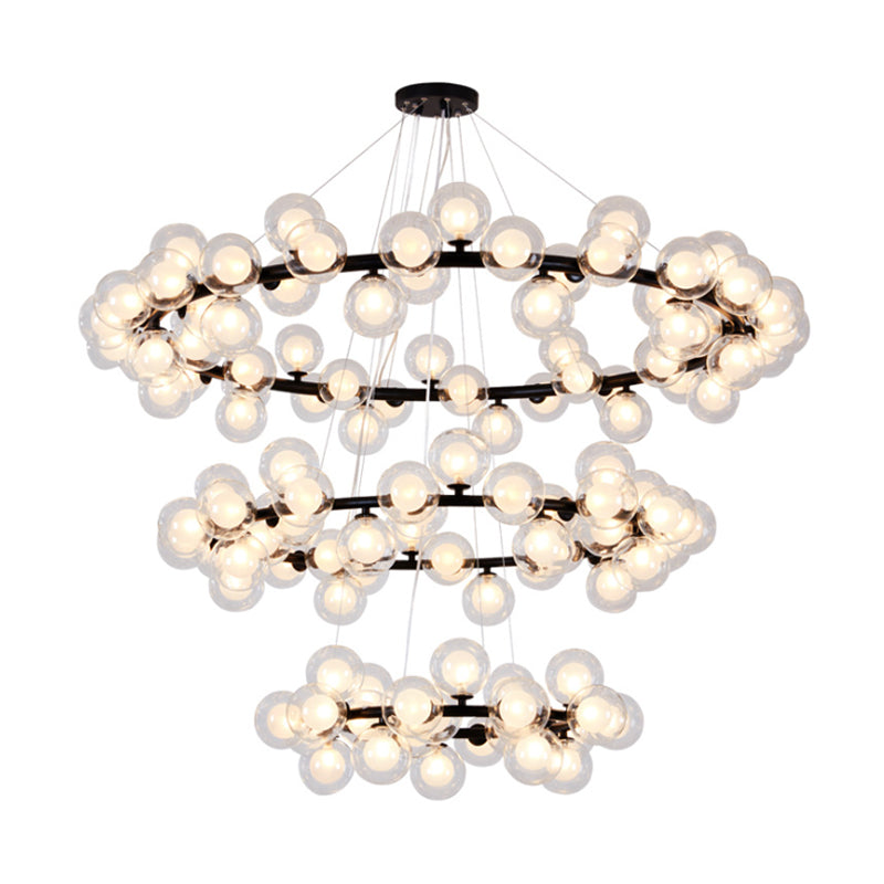 Bubble Chandelier Light Contemporary Clear Glass 2/3 Tiers Black Finish Hanging Lamp with Metal Ring for Living Room Clearhalo 'Ceiling Lights' 'Chandeliers' 'Glass shade' 'Glass' 'Modern Chandeliers' 'Modern' Lighting' 113216