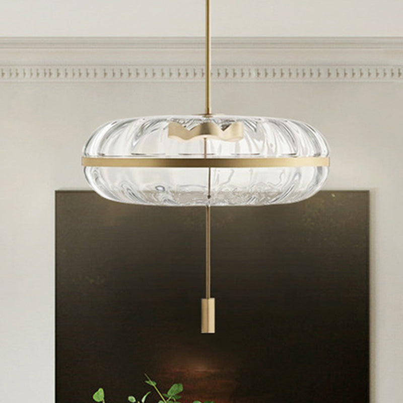 Clear Ribbed Glass Doughnut Pendant Post-Modern 1 Head Brass Hanging Light Fixture over Table Clear Clearhalo 'Ceiling Lights' 'Glass shade' 'Glass' 'Modern Pendants' 'Modern' 'Pendant Lights' 'Pendants' Lighting' 1135683