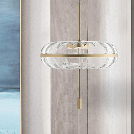 Clear Ribbed Glass Doughnut Pendant Post-Modern 1 Head Brass Hanging Light Fixture over Table Clearhalo 'Ceiling Lights' 'Glass shade' 'Glass' 'Modern Pendants' 'Modern' 'Pendant Lights' 'Pendants' Lighting' 1135684