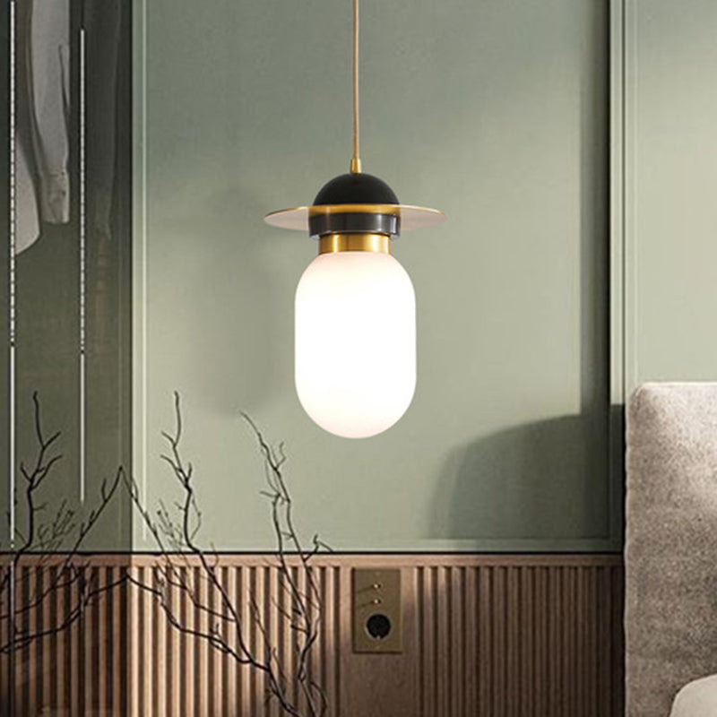 Pill Capsule Pendant Light Fixture Post-Modern White Glass Single Bedside Suspension Lamp in Brass White Clearhalo 'Ceiling Lights' 'Glass shade' 'Glass' 'Modern Pendants' 'Modern' 'Pendant Lights' 'Pendants' Lighting' 1135723