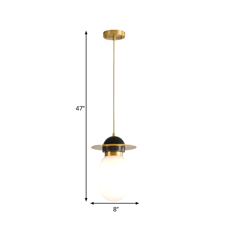 Pill Capsule Pendant Light Fixture Post-Modern White Glass Single Bedside Suspension Lamp in Brass Clearhalo 'Ceiling Lights' 'Glass shade' 'Glass' 'Modern Pendants' 'Modern' 'Pendant Lights' 'Pendants' Lighting' 1135726