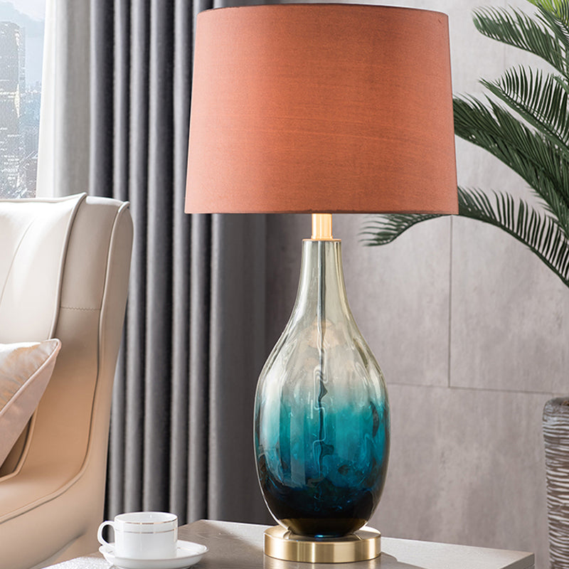 Beige/Brown 1 Head Nightstand Lamp Contemporary Fabric Drum Table Lighting with Jar Fading Blue Glass Base Clearhalo 'Lamps' 'Table Lamps' Lighting' 1136558