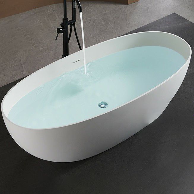 Modern Style Freestanding Soaking Bathtub Stone Bathroom Bathtub in White Clearhalo 'Bathroom Remodel & Bathroom Fixtures' 'Bathtubs' 'Home Improvement' 'home_improvement' 'home_improvement_bathtubs' 'Showers & Bathtubs' 1200x1200_069b94a1-106e-4eed-b22c-3024aa453889