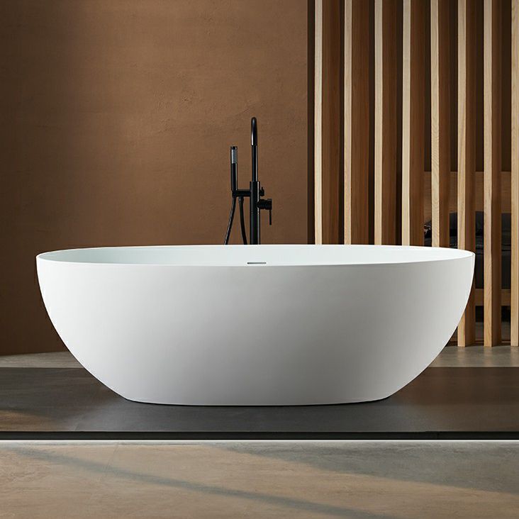 Modern Style Freestanding Soaking Bathtub Stone Bathroom Bathtub in White Clearhalo 'Bathroom Remodel & Bathroom Fixtures' 'Bathtubs' 'Home Improvement' 'home_improvement' 'home_improvement_bathtubs' 'Showers & Bathtubs' 1200x1200_2d9168e6-bac7-42f2-b8f8-646062d24374