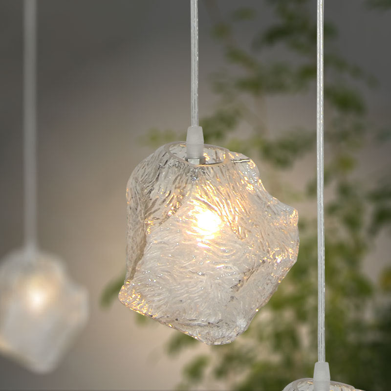 Rock Clear Glass Cluster Pendant Contemporary 5/6/8 Lights White Led Hanging Light Fixture with Round/Linear Canopy Clearhalo 'Ceiling Lights' 'Glass shade' 'Glass' 'Modern Pendants' 'Modern' 'Pendant Lights' 'Pendants' Lighting' 122117