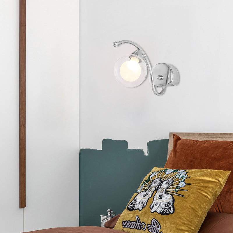 Modern Globe Wall Lamp Clear Glass 1 Light Bedroom Led Wall Light Sconce in Chrome with Curved Arm Chrome Clearhalo 'Cast Iron' 'Glass' 'Industrial' 'Modern wall lights' 'Modern' 'Tiffany' 'Traditional wall lights' 'Wall Lamps & Sconces' 'Wall Lights' Lighting' 128984