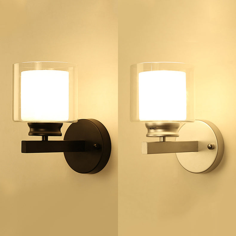 Cylinder Clear Glass Sconce Lighting Modern 1 Light Black/Chrome Wall Mounted Light Fixture Clearhalo 'Cast Iron' 'Glass' 'Industrial' 'Modern wall lights' 'Modern' 'Tiffany' 'Traditional wall lights' 'Wall Lamps & Sconces' 'Wall Lights' Lighting' 131677