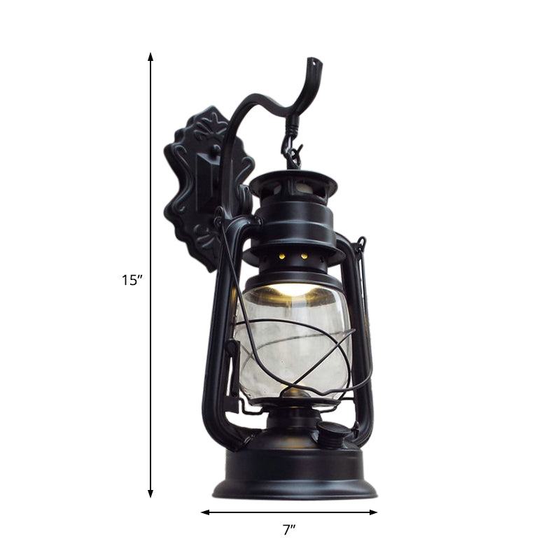 Clear Glass Black/Antique Brass Wall Sconce Lighting Lantern 1-Light Coastal Light Fixture for Porch Clearhalo 'Art deco wall lights' 'Cast Iron' 'Glass' 'Industrial wall lights' 'Industrial' 'Middle century wall lights' 'Modern' 'Rustic wall lights' 'Tiffany' 'Traditional wall lights' 'Wall Lamps & Sconces' 'Wall Lights' Lighting' 138773