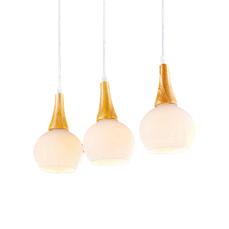 3 Heads Global Pendant Lamp Modernist White Glass and Wood Ceiling Light Fixture for Dining Table Clearhalo 'Ceiling Lights' 'Close To Ceiling Lights' 'Glass shade' 'Glass' 'Modern Pendants' 'Modern' 'Pendant Lights' 'Pendants' Lighting' 141668