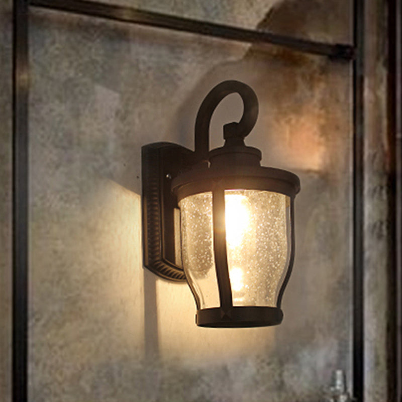 Seeded Glass Caged Wall Sconce Industrial 1 Light Dining Room Lighting Fixture in Black Clearhalo 'Art deco wall lights' 'Cast Iron' 'Glass' 'Industrial wall lights' 'Industrial' 'Middle century wall lights' 'Modern' 'Rustic wall lights' 'Tiffany' 'Traditional wall lights' 'Wall Lamps & Sconces' 'Wall Lights' Lighting' 1419605