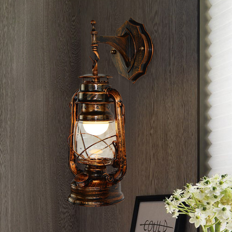 One Bulb Wall Light with Lantern Shade Clear Glass Coastal Bathroom Sconce in Antique Copper Clearhalo 'Art deco wall lights' 'Cast Iron' 'Glass' 'Industrial wall lights' 'Industrial' 'Middle century wall lights' 'Modern' 'Rustic wall lights' 'Tiffany' 'Traditional wall lights' 'Wall Lamps & Sconces' 'Wall Lights' Lighting' 1419907
