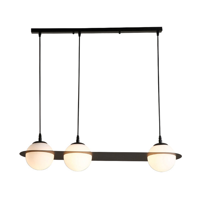 Ball White Glass Cluster Pendant with Straight/Curved Design Modernist 2/3 Lights Black Led Hanging Lamp Clearhalo 'Ceiling Lights' 'Glass shade' 'Glass' 'Modern Pendants' 'Modern' 'Pendant Lights' 'Pendants' Lighting' 143078