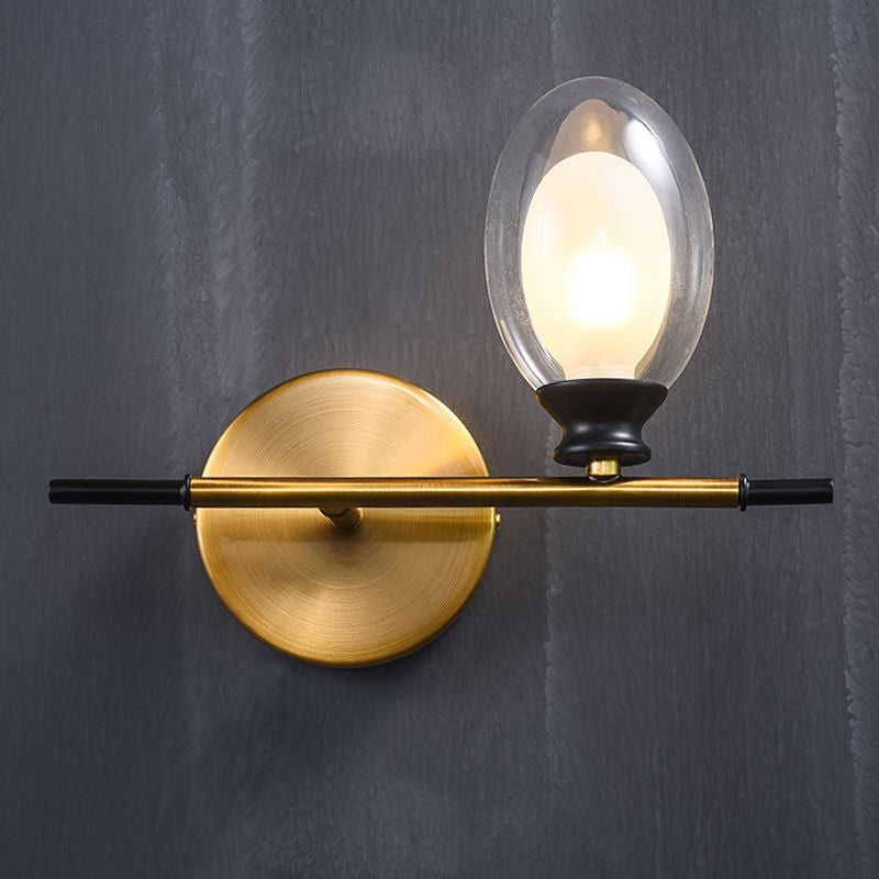 Vintage Oval Wall Sconce 1 Light Clear Glass Bedroom Wall Mounted Lamp with Brass Bar Clearhalo 'Cast Iron' 'Glass' 'Industrial' 'Modern wall lights' 'Modern' 'Tiffany' 'Traditional wall lights' 'Vanity Lights' 'Wall Lights' Lighting' 1433708