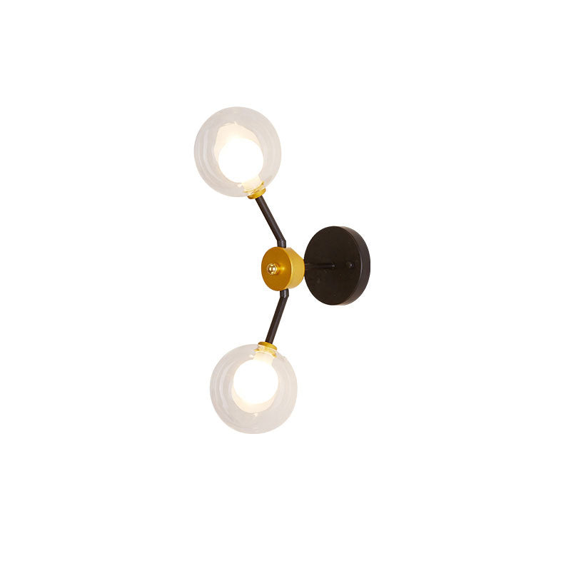 2 Lights Bedroom Sconce Light with Global Clear Glass Shade Modern Black Led Wall Mount Light Clearhalo 'Cast Iron' 'Glass' 'Industrial' 'Modern wall lights' 'Modern' 'Tiffany' 'Traditional wall lights' 'Wall Lamps & Sconces' 'Wall Lights' Lighting' 144492