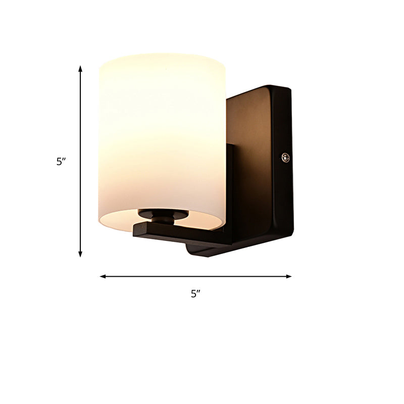 White Shade Sconce Light with Black Base 1 Light Modern Style Milk Glass Wall Sconce for Living Room Clearhalo 'Cast Iron' 'Glass' 'Industrial' 'Modern wall lights' 'Modern' 'Tiffany' 'Traditional wall lights' 'Wall Lamps & Sconces' 'Wall Lights' Lighting' 145136