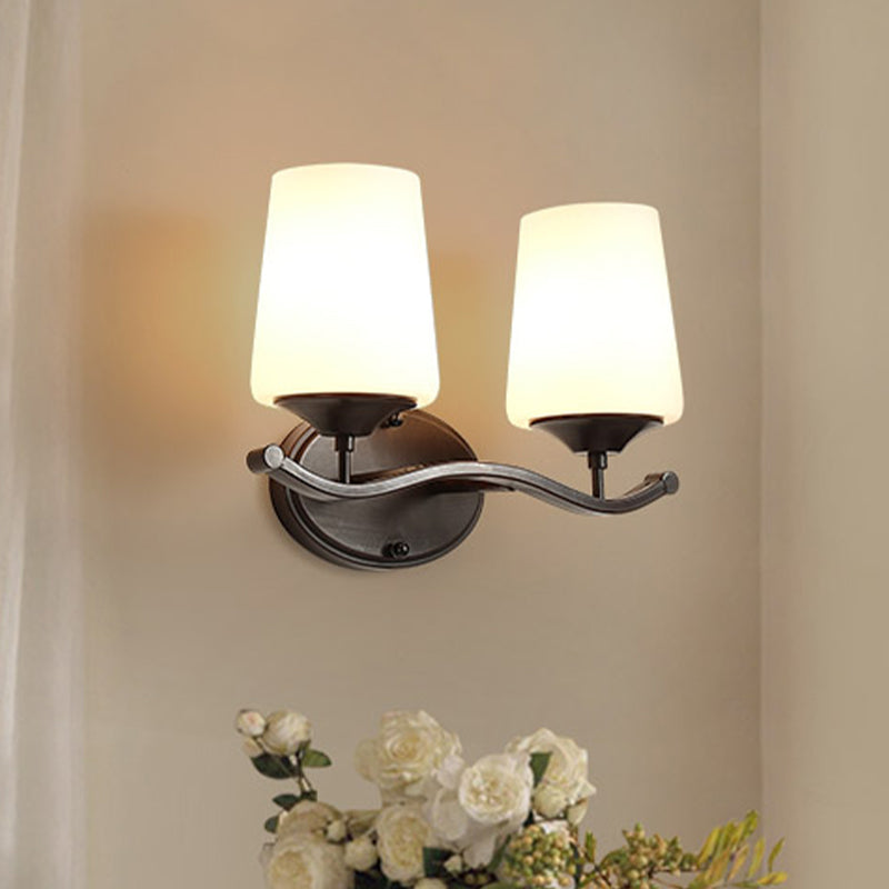 2/3-Bulb Ivory Glass Vanity Lighting Traditional Black Tapered Bedroom Wall Light with Iron Wavy Arm 2.0 Black Clearhalo 'Vanity Lights' 'Wall Lights' Lighting' 1454572