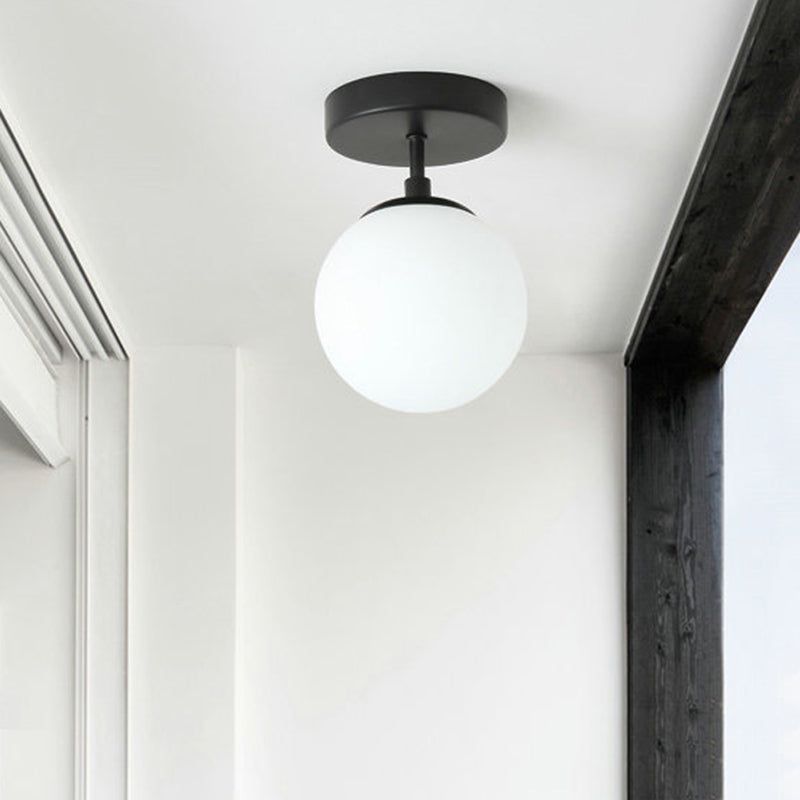 Single Bulb Corridor Ceiling Flush Simple Black Semi Flush Mount Light with Mini Spherical Milk Glass Shade Clearhalo 'Ceiling Lights' 'Close To Ceiling Lights' 'Close to ceiling' 'Glass shade' 'Glass' 'Semi-flushmount' Lighting' 1454785