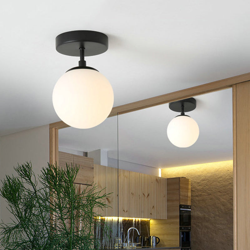 Single Bulb Corridor Ceiling Flush Simple Black Semi Flush Mount Light with Mini Spherical Milk Glass Shade Clearhalo 'Ceiling Lights' 'Close To Ceiling Lights' 'Close to ceiling' 'Glass shade' 'Glass' 'Semi-flushmount' Lighting' 1454786