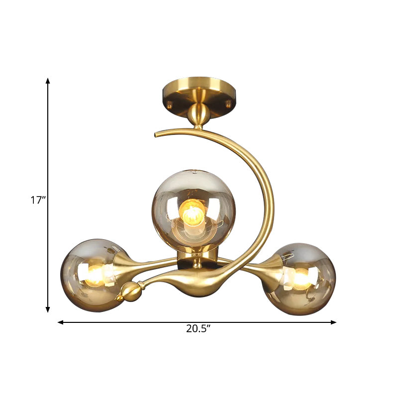 Burst Semi Flush Chandelier Postmodern Amber Glass Orb 3/5 Heads Brass Ceiling Mounted Light with Curved Arm over Table Clearhalo 'Ceiling Lights' 'Close To Ceiling Lights' 'Close to ceiling' 'Glass shade' 'Glass' 'Semi-flushmount' Lighting' 1454846