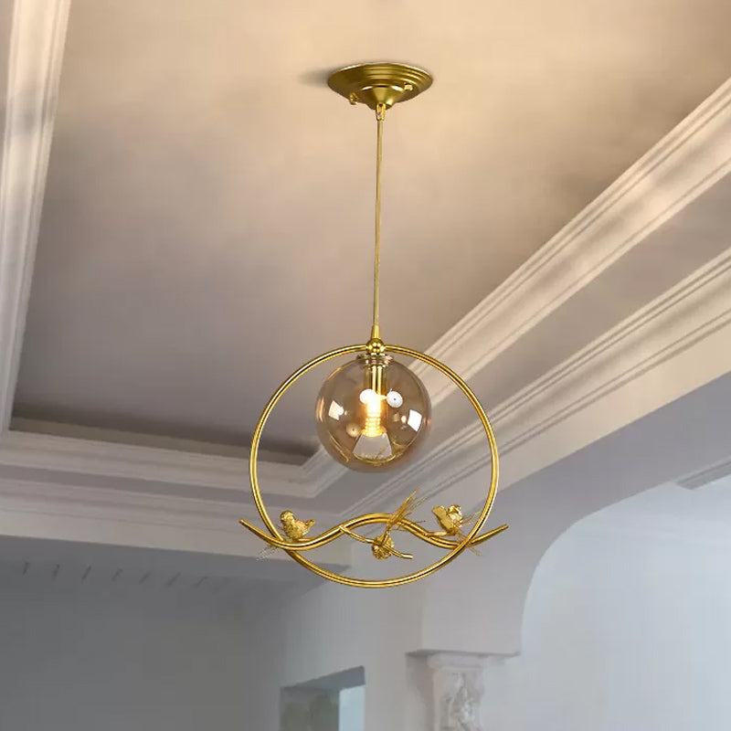 Brass Ring Hanging Pendant Mid-Century Single Bulb Metal Ceiling Lamp with Amber/Smoke Grey Glass Shade and Bird Deco Amber Clearhalo 'Ceiling Lights' 'Glass shade' 'Glass' 'Modern Pendants' 'Modern' 'Pendant Lights' 'Pendants' Lighting' 1455010