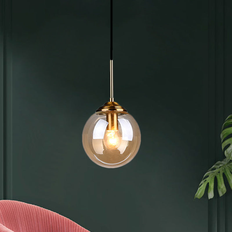 1-Light Dining Room Ceiling Pendant Simple Brass Hanging Lamp with Spherical Amber/Smoke Glass Shade Amber Clearhalo 'Ceiling Lights' 'Close To Ceiling Lights' 'Glass shade' 'Glass' 'Modern Pendants' 'Modern' 'Pendant Lights' 'Pendants' Lighting' 1455019