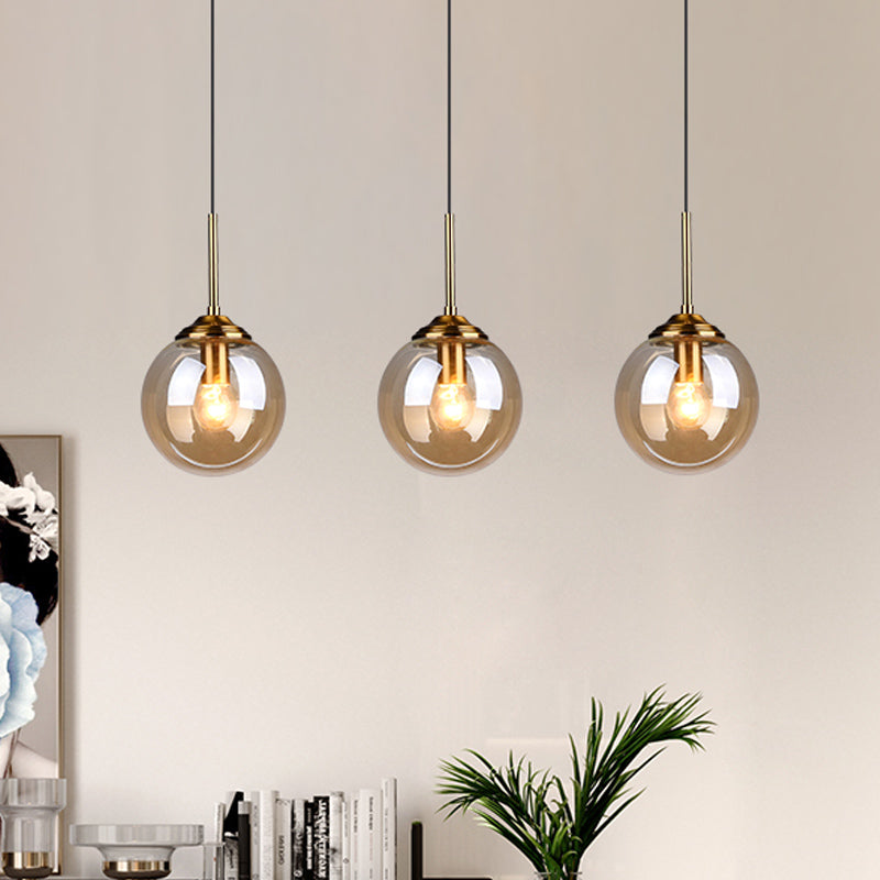 1-Light Dining Room Ceiling Pendant Simple Brass Hanging Lamp with Spherical Amber/Smoke Glass Shade Clearhalo 'Ceiling Lights' 'Close To Ceiling Lights' 'Glass shade' 'Glass' 'Modern Pendants' 'Modern' 'Pendant Lights' 'Pendants' Lighting' 1455020