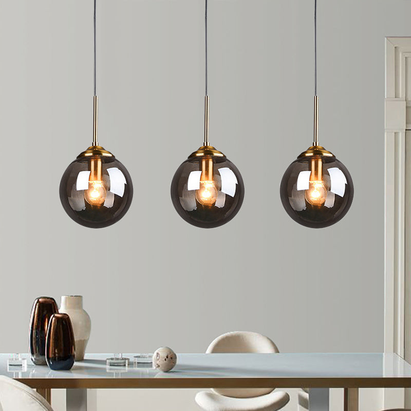 1-Light Dining Room Ceiling Pendant Simple Brass Hanging Lamp with Spherical Amber/Smoke Glass Shade Clearhalo 'Ceiling Lights' 'Close To Ceiling Lights' 'Glass shade' 'Glass' 'Modern Pendants' 'Modern' 'Pendant Lights' 'Pendants' Lighting' 1455025