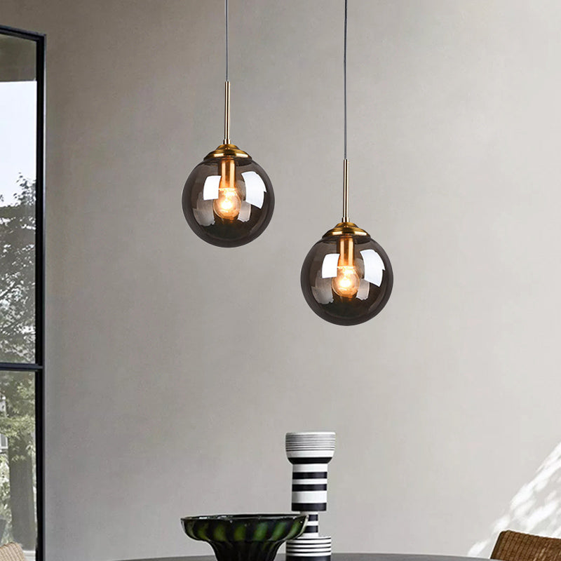 1-Light Dining Room Ceiling Pendant Simple Brass Hanging Lamp with Spherical Amber/Smoke Glass Shade Clearhalo 'Ceiling Lights' 'Close To Ceiling Lights' 'Glass shade' 'Glass' 'Modern Pendants' 'Modern' 'Pendant Lights' 'Pendants' Lighting' 1455026