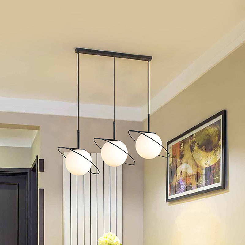 Opal Matte Glass Planet Multi-Light Pendant Postmodern 3 Bulbs Black Hanging Lamp Kit over Dining Table Clearhalo 'Ceiling Lights' 'Glass shade' 'Glass' 'Modern Pendants' 'Modern' 'Pendant Lights' 'Pendants' Lighting' 1475996