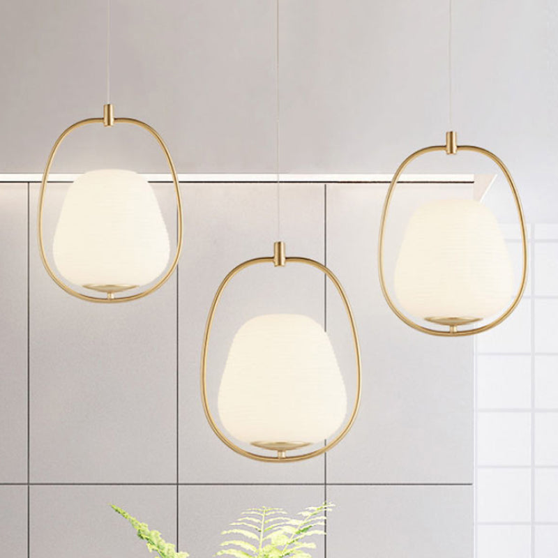 Oval Dining Room Pendant White Glass 1 Light Modern Hanging Lamp Fixture in Gold with Iron Ring Clearhalo 'Ceiling Lights' 'Glass shade' 'Glass' 'Modern Pendants' 'Modern' 'Pendant Lights' 'Pendants' Lighting' 1523436