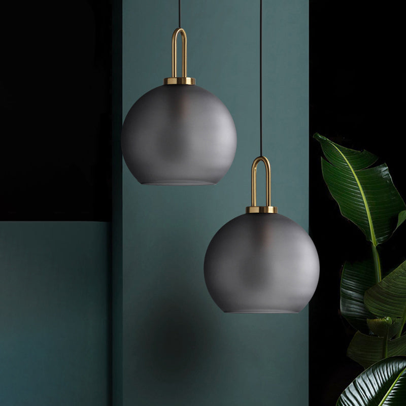 1 Light Living Room Pendant Lamp with Globe Clear/Smoky Glass Shade Modern Brass Hanging Lamp Kit, 8"/10"/12" Wide Smoke Gray Clearhalo 'Ceiling Lights' 'Glass shade' 'Glass' 'Modern Pendants' 'Modern' 'Pendant Lights' 'Pendants' Lighting' 1523685