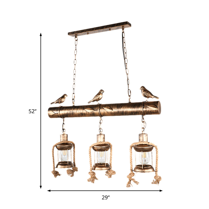 Coastal Lantern Island Pendant 3-Light Clear Glass Hanging Lamp Kit in Antique Brass with Bird Clearhalo 'Ceiling Lights' 'Island Lights' Lighting' 162847