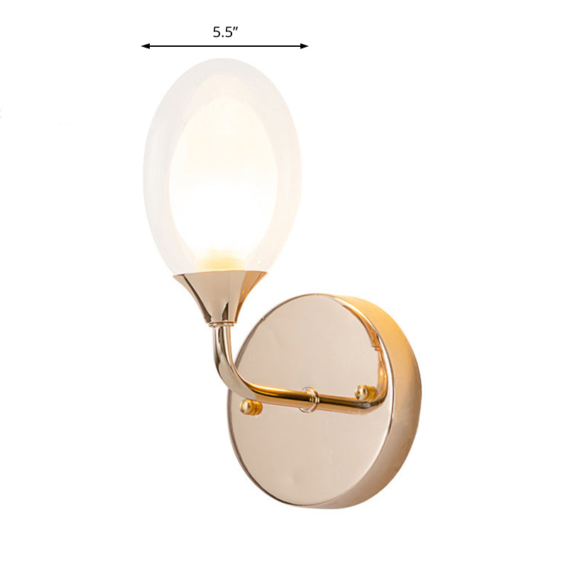 Modern Oval Shade Wall Lighting 1 Bulb Clear Glass Sconce Light in Brass for Dining Room Clearhalo 'Cast Iron' 'Glass' 'Industrial' 'Modern wall lights' 'Modern' 'Tiffany' 'Traditional wall lights' 'Wall Lamps & Sconces' 'Wall Lights' Lighting' 165902