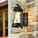 Clear Glass Kerosene Lamp Wall Light Farmhouse 1 Head Patio Wall Lighting with Curved Arm in Black Black Clearhalo 'Art deco wall lights' 'Cast Iron' 'Glass' 'Industrial wall lights' 'Industrial' 'Middle century wall lights' 'Modern' 'Rustic wall lights' 'Tiffany' 'Traditional wall lights' 'Wall Lamps & Sconces' 'Wall Lights' Lighting' 1687490