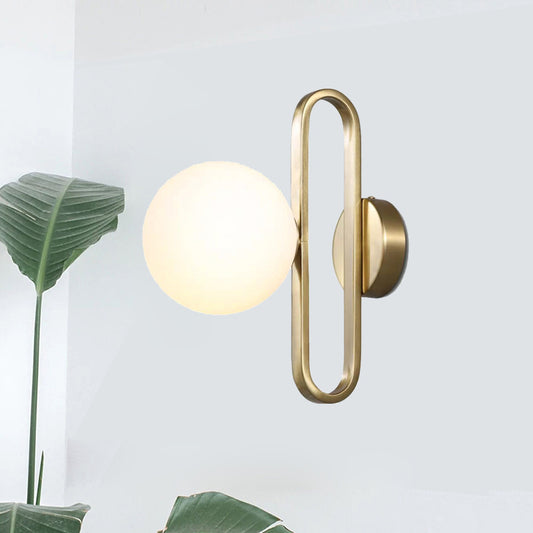 Cream Matte Glass Orb Wall Light Minimalist 1 Bulb Sconce Lighting with Gold Oval Arm Clearhalo 'Cast Iron' 'Glass' 'Industrial' 'Modern wall lights' 'Modern' 'Tiffany' 'Traditional wall lights' 'Wall Lamps & Sconces' 'Wall Lights' Lighting' 1788569
