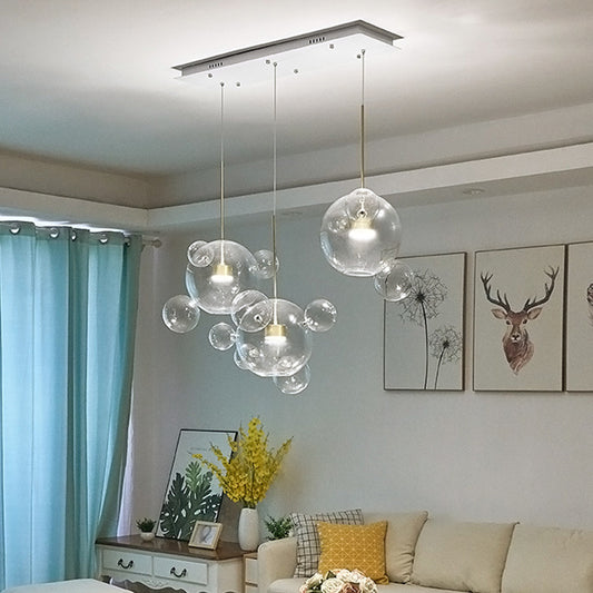 Modernist 3 Lights Down Lighting White Molecule-Shape Multi Pendant with Clear Glass Shade White Clearhalo 'Ceiling Lights' 'Close To Ceiling Lights' 'Glass shade' 'Glass' 'Modern Pendants' 'Modern' 'Pendant Lights' 'Pendants' Lighting' 1804445