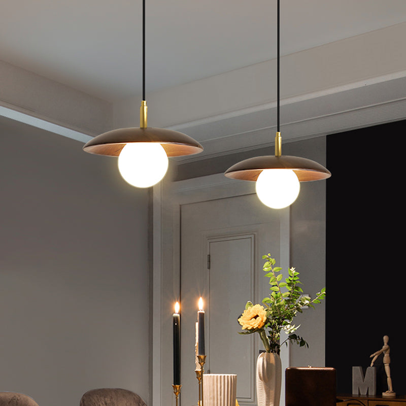 White Glass Ball/Bun Suspension Lamp Modernism 1 Light Down Lighting with Wood Saucer Top in Brown Clearhalo 'Ceiling Lights' 'Modern Pendants' 'Modern' 'Pendant Lights' 'Pendants' Lighting' 1804556