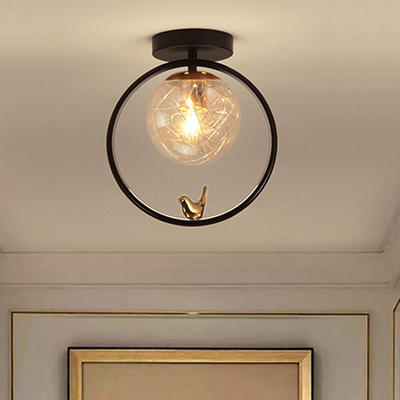 Spherical Semi Flush Light Contemporary Clear Glass Single Bulb Black Ceiling Mounted Fixture with Globe/Bird Decor Black Bird Clearhalo 'Ceiling Lights' 'Close To Ceiling Lights' 'Close to ceiling' 'Glass shade' 'Glass' 'Pendant Lights' 'Semi-flushmount' Lighting' 1865786