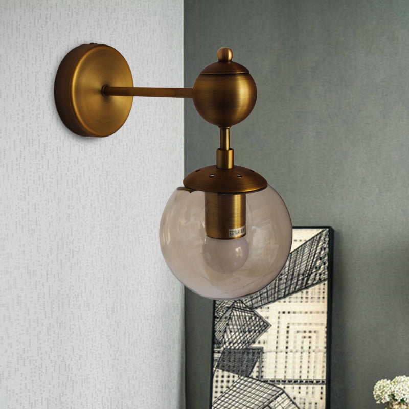 Globe Shaped Wall Sconce Post Modern Amber Glass 1/2 Light Brass Wall Mount Lighting Clearhalo 'Cast Iron' 'Glass' 'Industrial' 'Modern wall lights' 'Modern' 'Tiffany' 'Traditional wall lights' 'Wall Lamps & Sconces' 'Wall Lights' Lighting' 186755