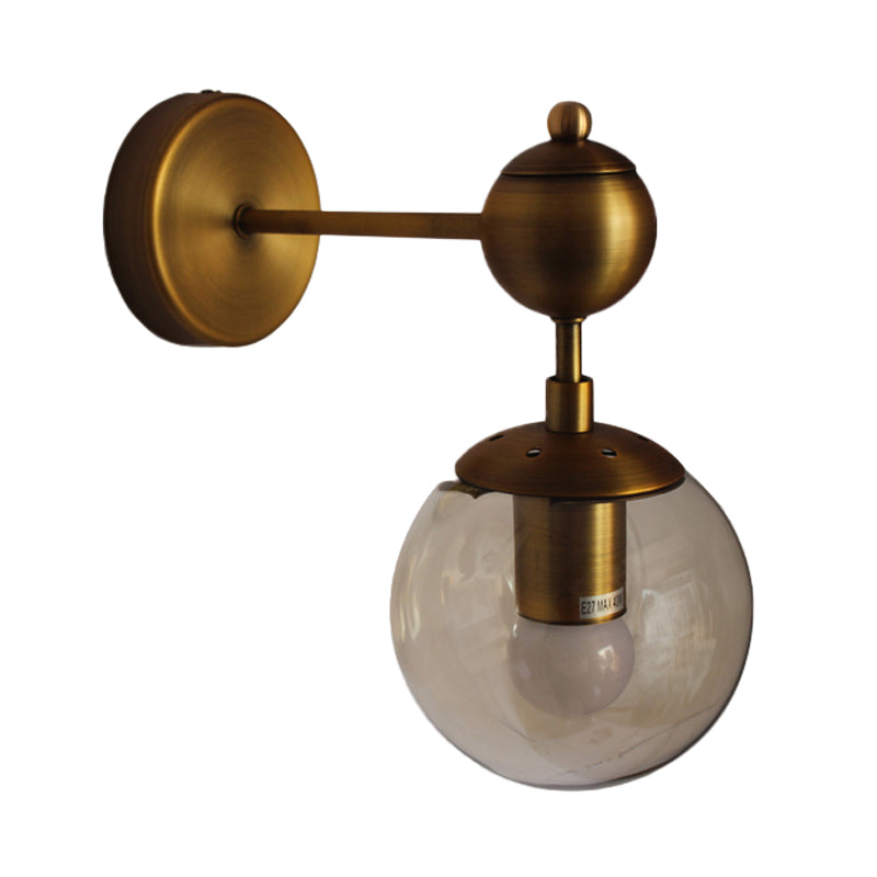 Globe Shaped Wall Sconce Post Modern Amber Glass 1/2 Light Brass Wall Mount Lighting Clearhalo 'Cast Iron' 'Glass' 'Industrial' 'Modern wall lights' 'Modern' 'Tiffany' 'Traditional wall lights' 'Wall Lamps & Sconces' 'Wall Lights' Lighting' 186756