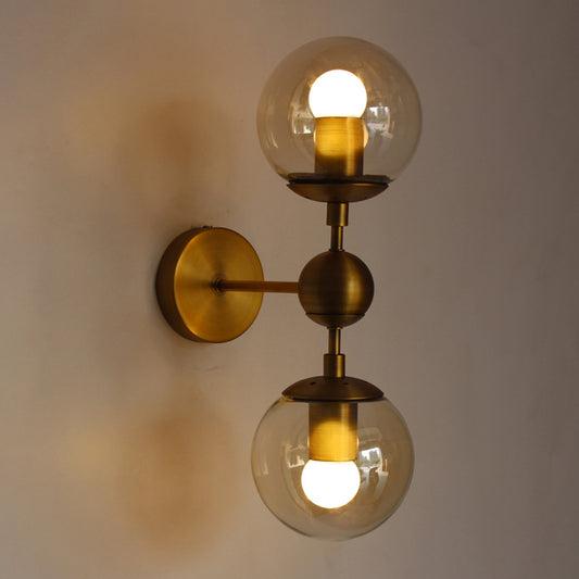 Globe Shaped Wall Sconce Post Modern Amber Glass 1/2 Light Brass Wall Mount Lighting Clearhalo 'Cast Iron' 'Glass' 'Industrial' 'Modern wall lights' 'Modern' 'Tiffany' 'Traditional wall lights' 'Wall Lamps & Sconces' 'Wall Lights' Lighting' 186759