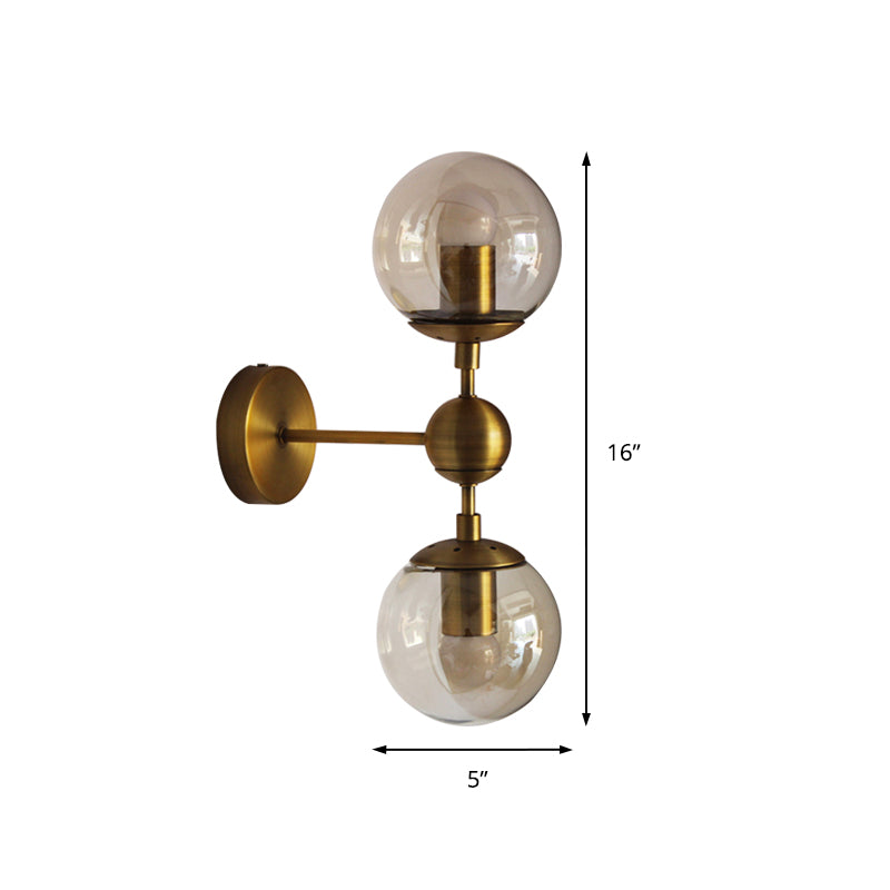 Globe Shaped Wall Sconce Post Modern Amber Glass 1/2 Light Brass Wall Mount Lighting Clearhalo 'Cast Iron' 'Glass' 'Industrial' 'Modern wall lights' 'Modern' 'Tiffany' 'Traditional wall lights' 'Wall Lamps & Sconces' 'Wall Lights' Lighting' 186761