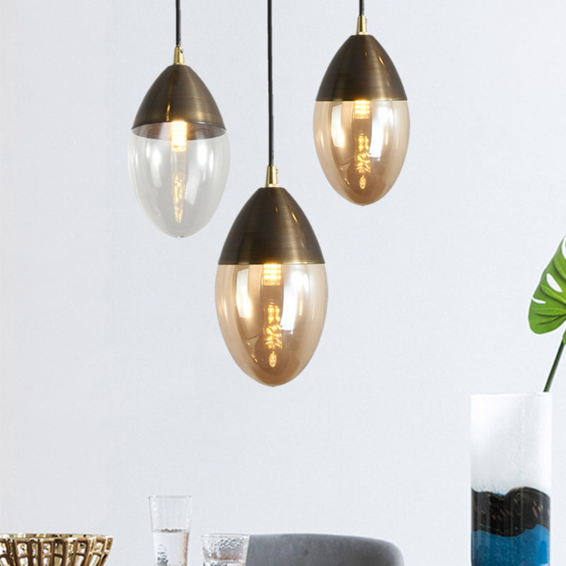 Post Modern Ellipsoid Suspension Pendant Clear/Amber Glass Led Dinging Room Ceiling Hung Light Clearhalo 'Ceiling Lights' 'Glass shade' 'Glass' 'Modern Pendants' 'Modern' 'Pendant Lights' 'Pendants' Lighting' 1903086