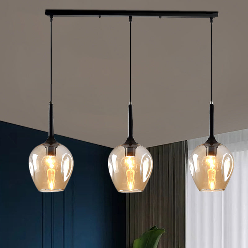 Tulip Cluster Pendant Lamp with Linear Design Modern Amber/Smoke/Blue Glass 3 Lights Black Ceiling Hung Light Amber Clearhalo 'Ceiling Lights' 'Chandeliers' 'Glass shade' 'Glass' 'Modern Pendants' 'Modern' 'Pendant Lights' 'Pendants' Lighting' 1903448