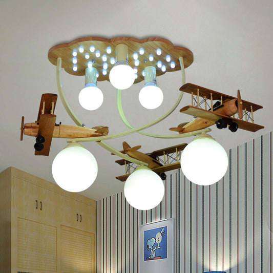 Creative Biplane Close to Ceiling Lamp Wooden 6 Heads Boys Room Flush Mount Light in Brown with Globe White Glass Shade Clearhalo 'Ceiling Lights' 'Close To Ceiling Lights' 'Close to ceiling' 'Flush mount' Lighting' 1909369