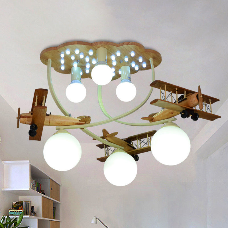 Creative Biplane Close to Ceiling Lamp Wooden 6 Heads Boys Room Flush Mount Light in Brown with Globe White Glass Shade Clearhalo 'Ceiling Lights' 'Close To Ceiling Lights' 'Close to ceiling' 'Flush mount' Lighting' 1909370