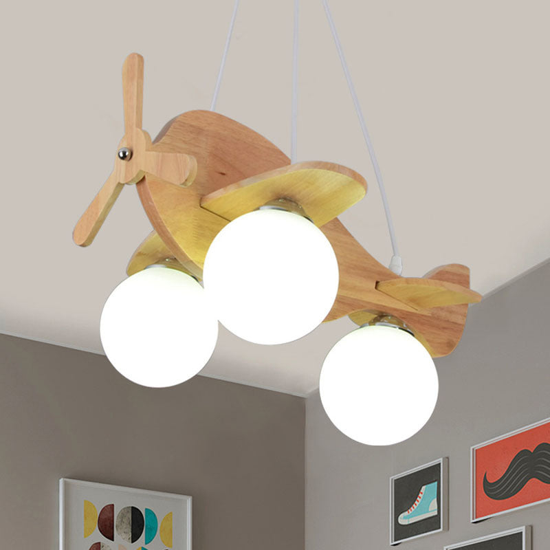 Creative Kids 3-Light Hanging Lamp Wood Plane Shaped Chandelier with Ball White Glass Shade Clearhalo 'Ceiling Lights' 'Chandeliers' Lighting' options 1909465